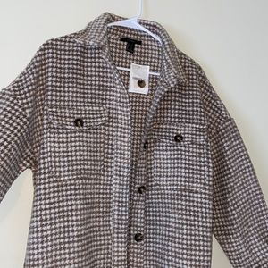 A tan/brown plaid shacket